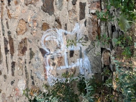 Graffiti on the stonewall to be removed