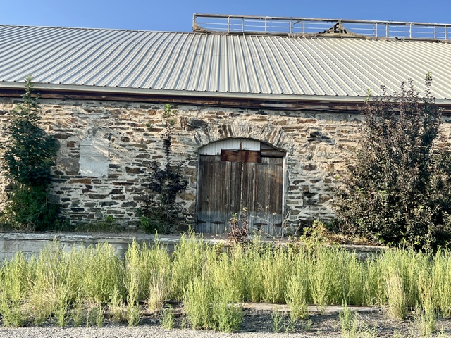 Arched stone barn doors